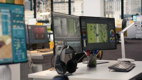 Empty office with architectural software shown on PC monitor in smart workspace Stock Photos