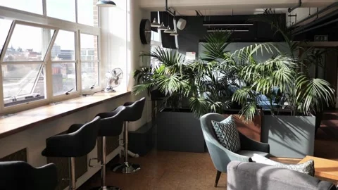 Empty office chairs in trendy millennial office cafe coworking space Vídeos de archivo 334027474