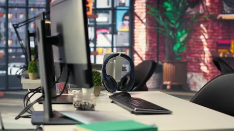 Empty office desk with computer screen showing terminal windows Stock Footage 308604863