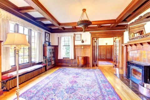 Empty office room with coffered ceiling, fireplace and cabinet Stock Photos