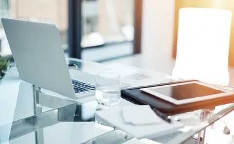 Empty office, technology and documents on desk in workspace for online research Stock Photos