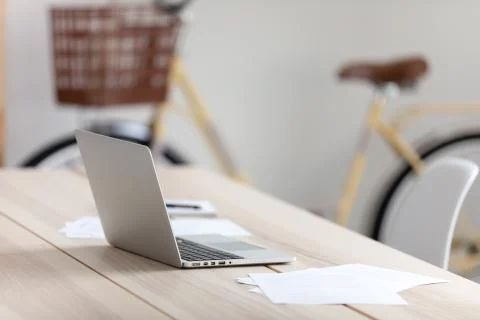 Empty office worker workplace, modern wooden table with laptop Stock Photos