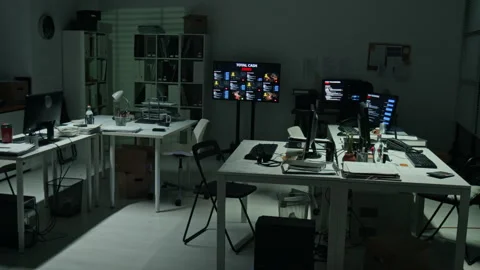 Empty Office Workspace with Glowing Computer Screens at Night Stock Footage 346695392