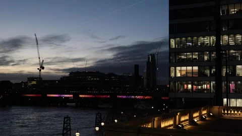 Empty offices with lights on at night, evening business building by Thames Video stock 331653647