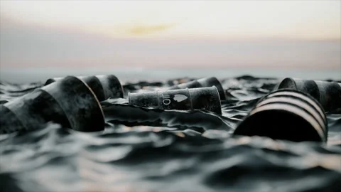 Empty oil barrels float in a sea of oil.... | Stock Video | Pond5
