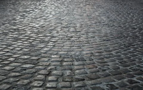 Empty old cobblestone street background with copy space Stock Photos