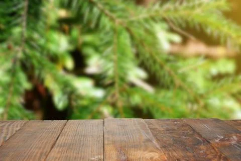 Empty old Dark wooden rustic table top made of planks with uneven edges on bl Stock Photos
