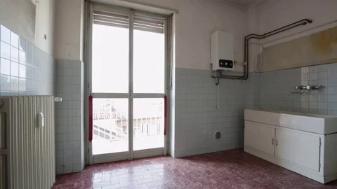 Empty old kitchen with blue tiled walls Stock Footage 72342574