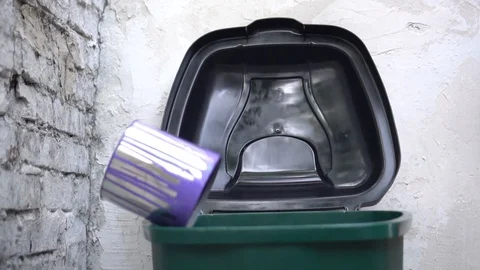 Empty old oil-based and latex paint cans disposed of in the regular trash Stock Footage 109469695