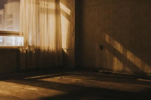 Empty old room with sheer curtains Stock Photos