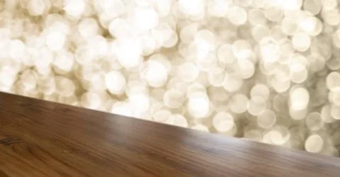 Empty old rustic angle wood table top with blur sparkling gold bokeh abstract Stock Photos