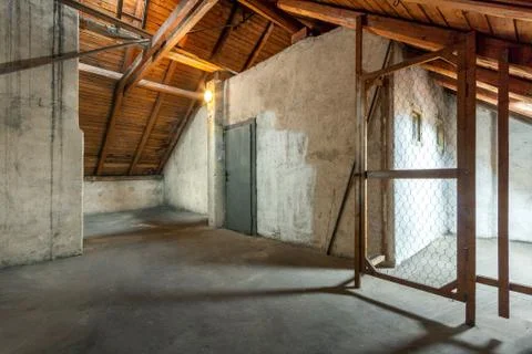 Empty old rustic attic with door. Stock Photos