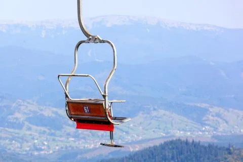 Empty old ski elevator chair close up. Stock Photos