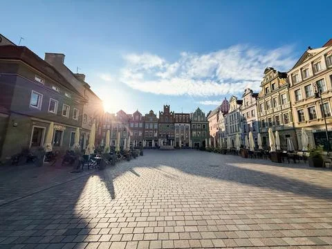 Empty Old town square Rynek in Poznan, Poland in the morning sunlight Stock Photos