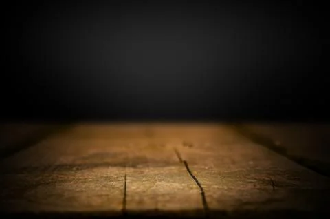 Empty old wooden table on black background Stock Photos