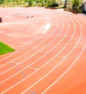 Empty olympic style running track for athletics Stock Photos