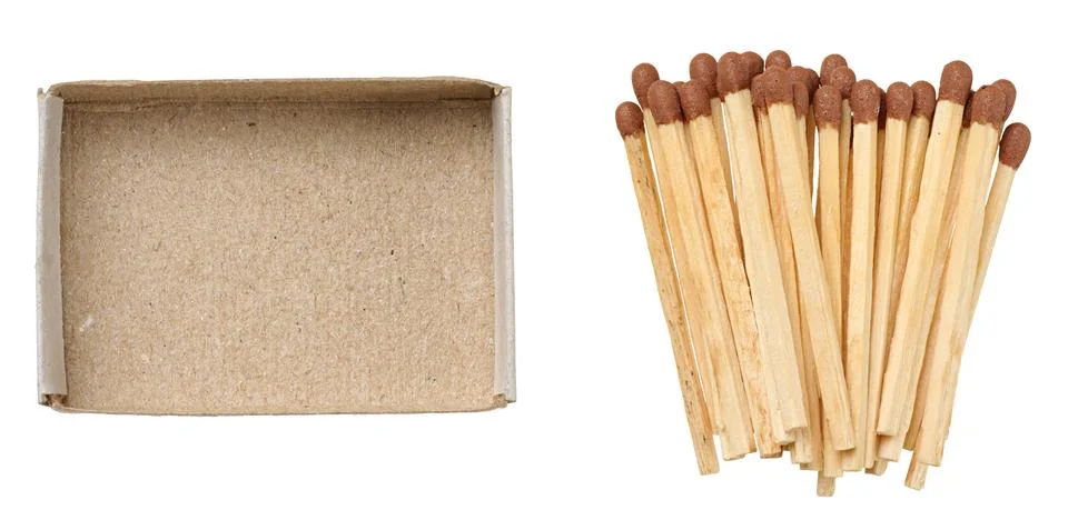 An empty open brown cardboard box and a scattering of new wooden matches wi.. Stock Photos