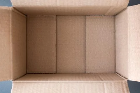 Empty open cardboard box, inside view. Close up Stock Photos