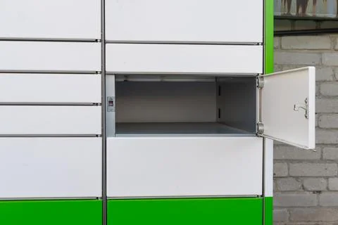 Empty open compartment of parcel locker system. Stockfoto's