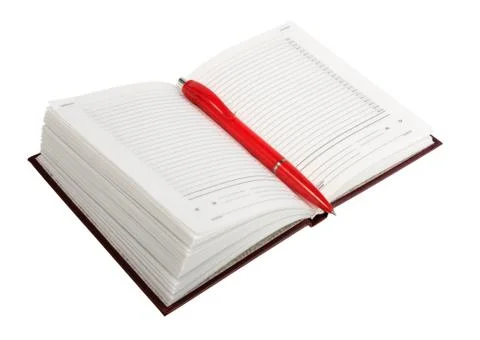 Empty open diary and red ball point pen Foto stock