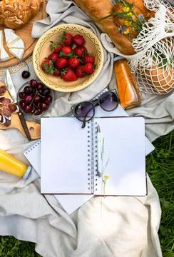 Empty open notepad. Summer paper mockup on the background of bright picnic Stock Photos