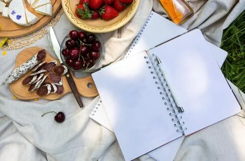Empty open notepad. Summer paper mockup on the background of bright picnic Stock Photos