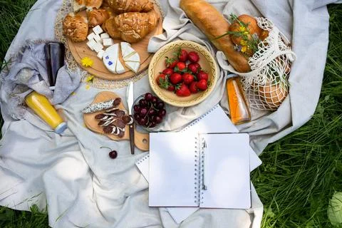 Empty open notepad. Summer paper mockup on the background of bright picnic Stock Photos