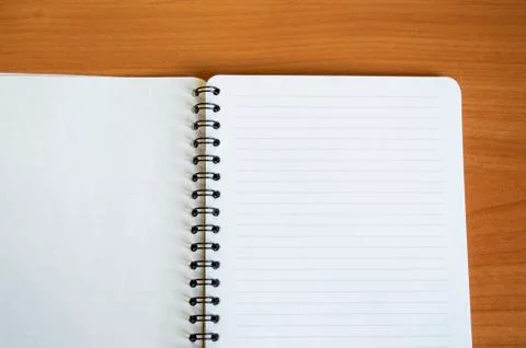 Empty open Notepad for writing, lies on a wooden brown table, top view, minim Foto stock