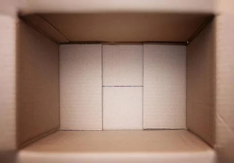 Empty open rectangular cardboard box close up. Stock Photos