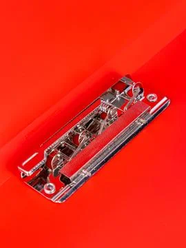 Empty open red  folder for papers with a metal clip, close up Stock Photos