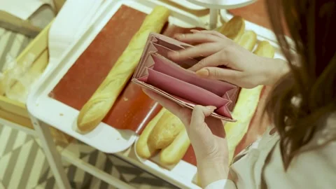 Empty open wallet in female hands. Stock Footage 172428364