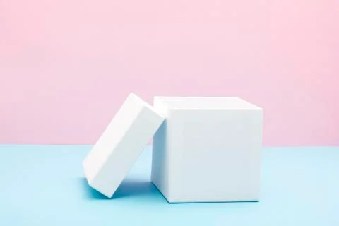 Empty, open white gift box on blue background with copy space 库存照片