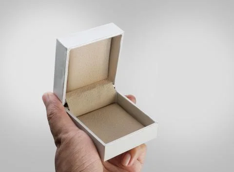 Empty Open White Jewelry Ring Box in a Hand Stock Photos