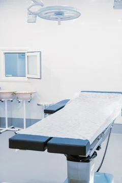 Empty operating room in a hospital. Surgical equipment with operating table Stock Photos