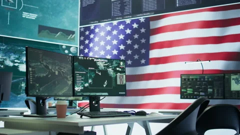 Empty operation room with American flag running on big screen in control tower Stock Footage 279951335