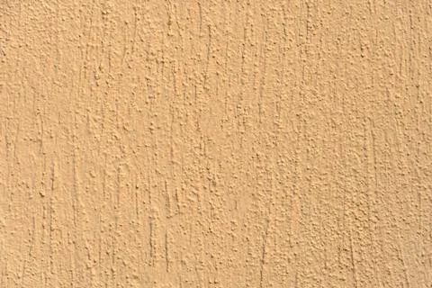 Empty orange background, texture, textured plaster on the wall. Building fa.. Foto stock