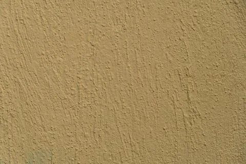 Empty orange background, texture, textured plaster on the wall. Building faca Foto stock