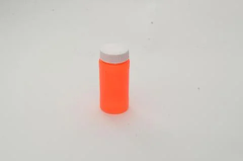 Empty orange bottle Stock Photos