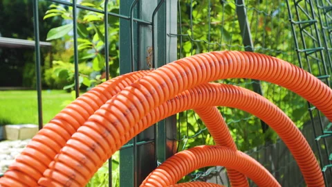 Empty orange cable protection pipe tube for fiber optic cable Stock Footage 133613044