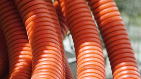 Empty orange cable protection pipe tube for fiber optic cable Stock Footage 133613625