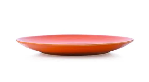 Empty orange ceramic plate isolated on white background. Stock Photos