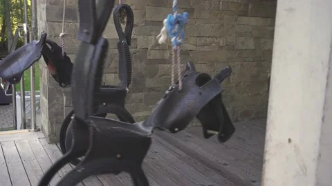 Empty original children's swing in the form of horses. Stock Footage 146708242