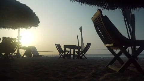 Empty outdoor cafe restaurant on beach at sunset Stock Footage 105417381