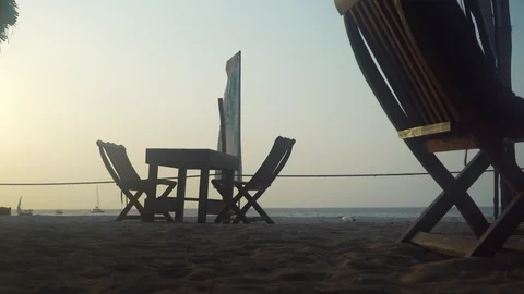 Empty outdoor cafe restaurant on beach at sunset Stock Footage 105417569