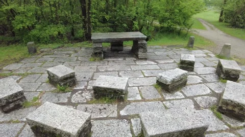 Empty outdoor classroom with stone benches and table in a public park Stock Footage 332707764