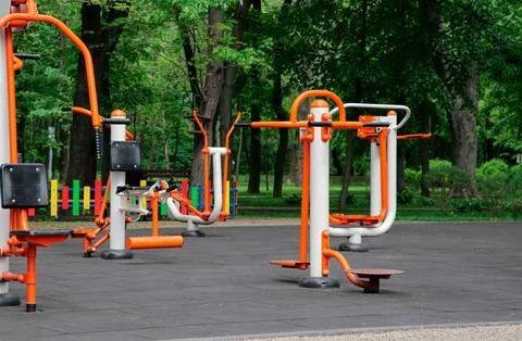 Empty outdoor gym with chest press machine, twister, ovate stepper and air .. Stock Photos