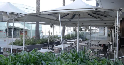 Empty Outdoor Restaurant Dining Area During Coronavirus Shutdown Stock Footage 129349464