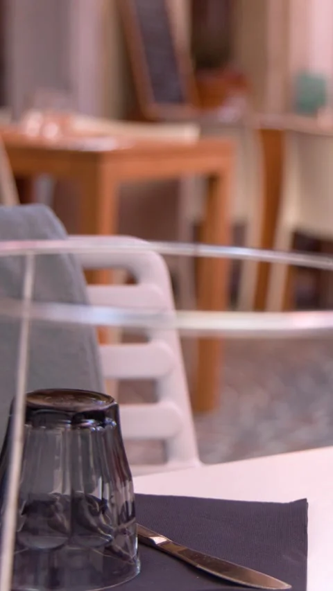 Empty Outdoor Restaurant Table Setting with Glass and Cutlery in Cassis Stock Footage 337925703