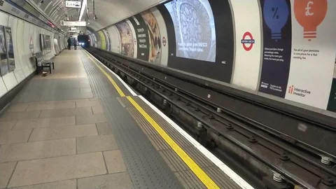 EMPTY OXFORD CIRCUS TRAIN PLATFORM DURING PEAK HOUR COVID-19 LOCKDOWN, LONDON Stock Footage 126613456