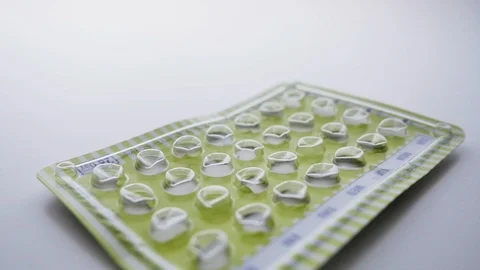 Empty Package of Birth Control Pills Falling in Slow Motion Stock Footage 112480751